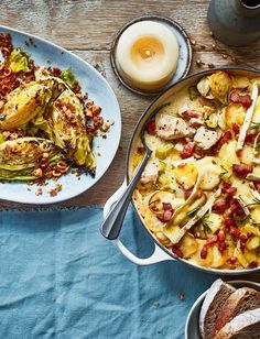 an assortment of food on a table including artichokes, bread and eggs