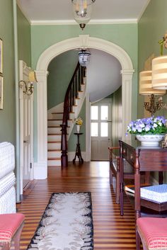 the hallway is clean and ready for us to use as an entrance way in this house