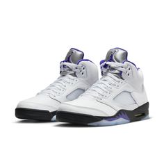 The Air Jordan 5 Retro Concord brings a classic color scheme with a modern twist. It features a sleek white leather upper, TPU netted underlays, and a reflective tongue all contrasted by accents of Concord found on the Jumpman logos, midsole shark teeth, and sockliner. Black is seen on the midsole with an Air cushioning heel unit and semi-translucent icy outsole finishing the design. A must-have for any sneaker fan's collection, this pair contributes throwback style to any look. Classic Basketball Shoes With Abzorb Midsole, Classic White Basketball Shoes, Classic White Basketball Shoes With Contrast Sole, Classic White Sneakers With Padded Tongue, Classic Leather Sneakers With Padded Tongue, Jordan 5 Concord, Jordan 5s, Nike Air Jordan 5, Jordan 5 Retro