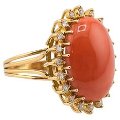 This is an exceptional, gorgeous Italian momo coral gold ring. It is surrounded with many diamonds to give it even more of a gorgeous sparkle. The color of the coral is natural and has not been dyed or processed like many other corals in the market. It has a nice dark red color better than the normal salmon or white color. The coral has a nice smooth luster feeling that shines at every angle. The gold purity on the ring is 14 karat. The quality on the diamonds ranges SI clarity from GHI color di Elegant Coral Rings For Anniversary, Coral Elegant Wedding Rings, Elegant Coral Wedding Rings, Coral Jewelry Vintage, Dark Red Color, Coral Ring, Coral And Gold, Coral Jewelry, Color Coral