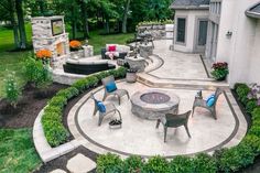 an outdoor patio with seating and fire pit