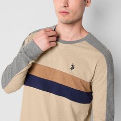 During the fall and winter seasons, it's essential to layer warm basics into your rotation like this striped long-sleeve men's t-shirt from U.S. Polo Assn. Cut for a classic-fit from soft, stretch cotton-jersey, this tee has a crew neckline, long sleeves, and is complete with the brand's logo embroidered at the front. Pair it with jeans and lace-up boots.Features: EmbroideredClosure Type: Pullover HeadFit: Classic FitNeckline: Crew NeckSleeve Length: Long SleeveFiber Content: 95% Cotton, 5% Span Crew Neck Tops With Contrast Stripes For Layering, Beige Cotton Color Block Tops, Beige Color Block Cotton Top, Beige Crew Neck Color Block Tops, Casual Winter Tops With Striped Sleeves, Large Shirts, Mens Crew Neck, Embroidered Shirt, Fall And Winter