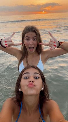 two girls in the water making funny faces