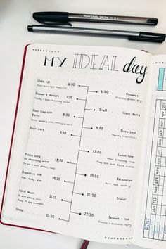 an open planner with the words, my ideal day on it and a pen next to it