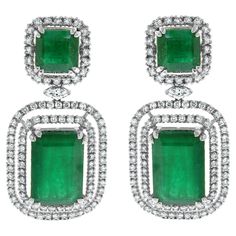 The Renee Emerald & Diamond Earrings are a unique and luxurious heritage pair with royal green emeralds and diamonds set in white gold. Gemstones Type: Emerald Gemstones Shape: Rectangular Gemstones Weight: 25.01 ct Gemstones Color: Green Diamonds Shapes: Round & Marquise Total Diamonds Weight: 3.01 ct Diamonds Color: H - J Diamonds Clarity: VS - SI (Very Slightly Included - Slightly Included) Metal: 14K Gold Metal Wt: 17.4 gms Setting: Prong Set Price Quoted may be negotiable. Please contact us to view and discuss.