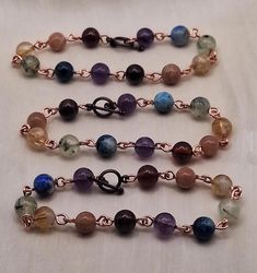 This handmade bohemian bracelet contains gemstone beads that represent the theme of LGBTQ+ PRIDE. The stones used in this bracelet are Hessonite Garnet, Peach Moonstone, Citrine, Prehnite, Azurite and Amethyst. Find more gemstone beaded creations at spaigecreations.etsy.com Material: 100% natural gemstones Hessonite Garnet, Peach Moonstone, Citrine, Prehnite, Azurite and Amethyst Durable copper wire Sizing: This is a standard size bracelet and is approximately 7.5 inches Style: Bohemian beaded bracelet Simple and stunning design Handmade / handcrafted This listing is for a single bracelet Free shipping on orders $35 and up! Free gift with every order! Bohemian Bracelets With 8mm Beads For Healing, Bohemian Beaded Bracelets For Healing, Bohemian Crystal Bracelet With 8mm Beads For Meditation, Bohemian Crystal Bracelet For Meditation With 8mm Beads, Bohemian Rosary Bracelet For Healing With Natural Stones, Bohemian Rosary Bracelet With Natural Stones For Healing, Hand Wrapped Rosary Bracelet With Round Beads For Healing, Hand Wrapped Rosary Bracelet For Healing, Bohemian Bracelets With 8mm Round Beads