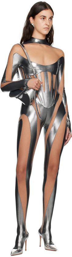 Semi-sheer stretch nylon tulle and jersey bodysuit. · Paneled construction · Mock neck · Logo bonded at chest · Boning at waist · Thumbhole at cuffs · Integrated feet · Zip closure at back Supplier color: Chrome