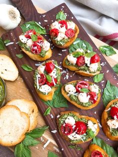 several pieces of bread with various toppings on them