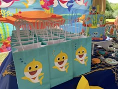 there are many bags on the table with cartoon characters painted on them, and one bag has an image of a shark