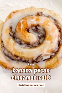 two cinnamon rolls on a white plate with the words easy banana pecan cinnamon rolls