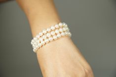 This Adorable Triple strand Japanese Cultured Akoya Pearl Bracelet set of 7-7.5mm AAA quality perfect round Akoya pearls with length of 7.5 inches ( can be personalized to the length you wanted). It is beautifully knotted with Japanese silk thread and secured with 7mm bead spacing dividers( Silver or 14KT white or yellow gold of your choice).  It is the best gift for the bride and add the class and elegancy to your wedding.  It can be finished with a Sterling Silver Square/Round Filigree clasp or 14KT Yellow Gold/White Gold Square/Round Filigree clasp. Pearl Jewelry Gift, Gift For The Bride, Japanese Silk, Perfect Wedding Gift, Akoya Pearls, Pearl Earrings Dangle, Strand Bracelet, Silk Thread, Japanese Culture