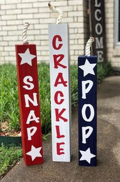 two red, white and blue wooden signs with the words cracker on them