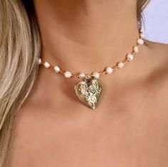 Are you looking for the perfect pearl locket necklace for someone special this spring-summer season? Or a unique and handmade bronze heart necklace for everyday wear to spoil yourself? Made with 18K gold filled stainless steel wire, dainty freshwater pearls and antique bronze lockets, my antique heart locket pendant is the perfect compliment to any outfit idea! My antique locket necklace is a great gift idea for any special occasion to all the women in your life. You can't go wrong when gifting Unique Locket Necklace Pearl, Pearl Heart Necklace, Pearl Locket, Locket Necklace Vintage, Real Pearl Necklace, Antique Locket, Vintage Lockets, Pearl Heart, Necklace Antique