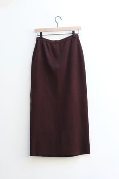 Minimalist brown knit midi skirt in a wool blend. Straight silhouette. Measurements Waist 28-30", Hips 40-42", Length 36" Brand Adrianna Papéll Tag Size Medium Fabric 80% Acrylic, 20% Wool Brown Solid Color Midi Skirt, Relaxed Fit Brown Knee-length Skirt, Non-stretch Long Brown Skirt, Elegant Brown Midi-length Skirt, Brown Non-stretch Midi Skirt, Knit Midi Skirt, Knit Midi, Leather Motorcycle Jacket, Flower Shirt