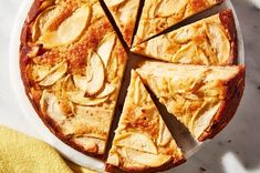 an apple pie is cut into slices on a plate