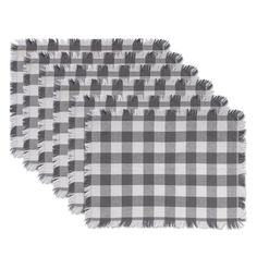 three gray and white checkered placemats with fringe ends on each one side