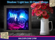 the shadow light box 3d paper design is next to a vase with flowers