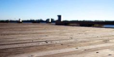 a skateboard is sitting on the edge of a dock