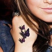 black and white photo of woman with butterfly tattoo