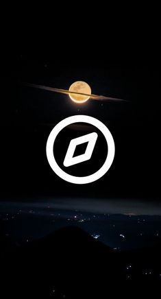 the moon is shining over some mountains and hills in the night sky, with an o logo above it