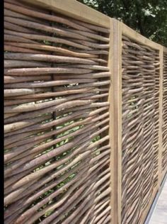 a wooden fence made out of sticks