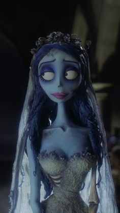 the corpse bride doll is dressed up in her wedding dress and veil with eyes wide open