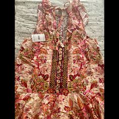 Gorgeous Brand New And Perfect For Summer Or Fall Free People Mini Dress With Ruffle Along Hemline And Ties In The Back. The Color Is Pink Combo On An Ecru Backgroundit’s Beautiful! Nwt. Can Also Be Worn As A Tunic With Leggings. Pink Ruffled Dress For Festival, Sleeveless Ruffled Maxi Dress For Festivals, Pink Boho Print Dress For Garden Party, Pink Boho Print Summer Dress, Pink Sleeveless Boho Print Dress, Pink Printed Festival Dress, Pink Floral Print Dress For Festival, Tunics With Leggings, Free People Boho