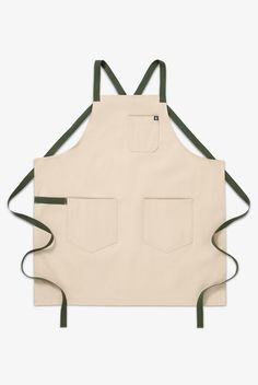 an apron with two pockets on the front and one pocket on the back, in beige