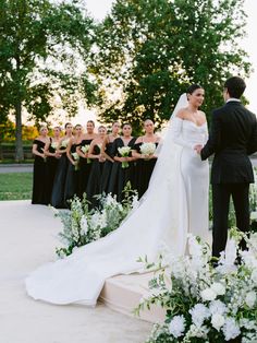 the bride and groom are getting married in front of their bridal party at sunset