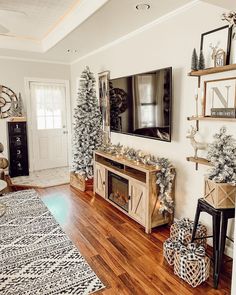 a living room decorated for christmas with decorations