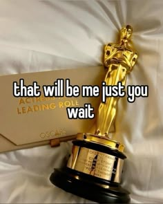 an oscar statue with the words that will be me just you waiting wait