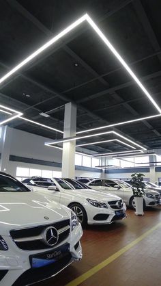 a group of cars parked inside of a building