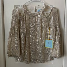 New With Tags Beautiful Champagne Colored Sequin Blouse With Shoulder Cutouts. Perfect For Holiday Season Coming Up!! Love This But Realized I Haven’t Worn It Since I Bought It And Want It To Be Appreciated! Size Extra Small Color: Gold/Champagne Condition: New With Tags!! Ask Me Any Questions And Feel Free To Make A Reasonable Offer! Glamorous Gold Tops For Spring, Gold Blouse For Spring Party, Spring Gold Sequined Blouse, Spring Gold Sequin Blouse, Glamorous Spring Festive Top, Glamorous Tops For Spring Festive Occasions, Glamorous Tops For Festive Spring Occasions, Champagne Blouse, Sequin Blouse