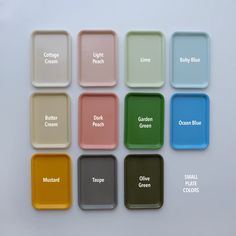 six different colored trays with names on them