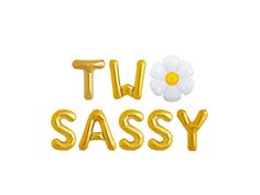 the words t v sassy written in gold foil balloons with a flower on top