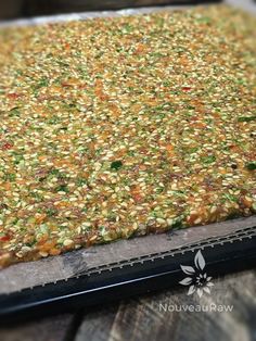 a close up view of a rug on top of a wooden table with metal grating