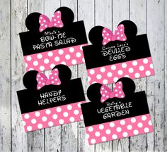 three minnie mouse ears with pink and white polka dots on them, one has a bow