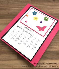 a calendar card with flowers and butterflies on it