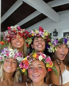 four women with flower crowns on their heads