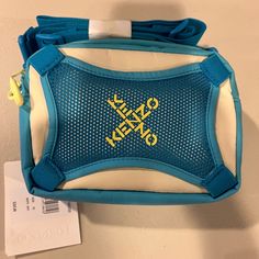 a blue and white bag with yellow letters on it