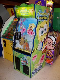 an arcade machine with spongebob characters on it