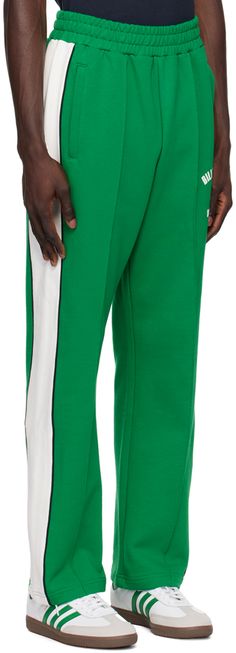 Straight-leg French terry track pants. · Concealed drawstring at elasticized waistband · Zip pockets · Logo and logo graphic screen-printed at front · Pinched seam at front legs · Piping at outseams Supplier color: Green Luxury Green Track Jacket For Men, Green Relaxed Fit Sportswear Pants, Green Sweatpants With Side Stripes For Streetwear, Sporty Green Track Jacket With Zipper Closure, Needles Track Pants, Boys Track Pants, Billionaire Boy, Billionaire Boys Club, Pants Straight