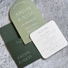 the wedding stationery is green and white