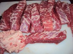 raw meat on a cutting board ready to be cooked