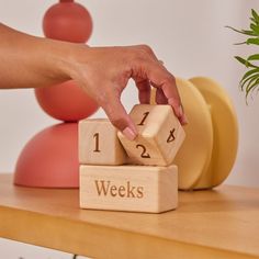 a wooden block with the words weeks on it