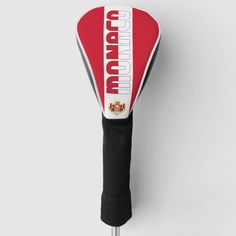 a close up of a red and white paddle on a metal stick with the word portugal printed on it