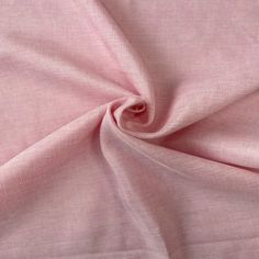 a close up view of the fabric on a pink shirting material that is very soft