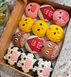 a box filled with lots of decorated cookies