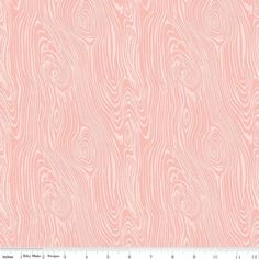 a pink background with wood grains in the shape of circles and wavy lines, as well as a ruler