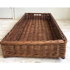 a large wicker basket sitting on top of a floor